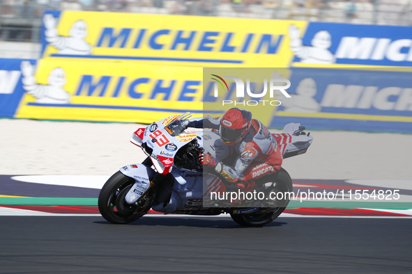 Ducati Spanish rider Jorge Martin rides ahead of Ducati Italian rider Francesco Bagnaia during the sprint race of the San Marino MotoGP Gran...