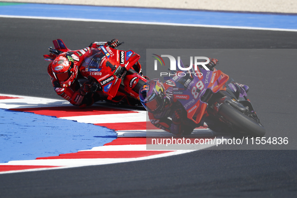 Ducati Spanish rider Jorge Martin rides ahead of Ducati Italian rider Francesco Bagnaia during the sprint race of the San Marino MotoGP Gran...