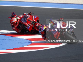 Ducati Spanish rider Jorge Martin rides ahead of Ducati Italian rider Francesco Bagnaia during the sprint race of the San Marino MotoGP Gran...