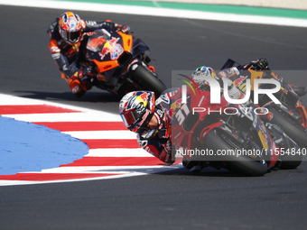 Ducati Spanish rider Jorge Martin rides ahead of Ducati Italian rider Francesco Bagnaia during the sprint race of the San Marino MotoGP Gran...