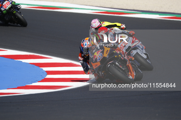 Ducati Spanish rider Jorge Martin rides ahead of Ducati Italian rider Francesco Bagnaia during the sprint race of the San Marino MotoGP Gran...