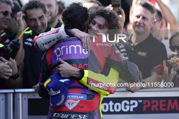 Marco Bezzecchi of Italy and Pertamina Enduro VR46 Racing Team congratulates Franco Morbidelli of Italy and Prima Pramac Racing during the q...