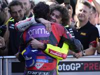 Marco Bezzecchi of Italy and Pertamina Enduro VR46 Racing Team congratulates Franco Morbidelli of Italy and Prima Pramac Racing during the q...