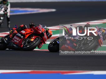 Jorge Martin of Spain and Prima Pramac Racing rides on track in front of Francesco Bagnaia of Italy and Ducati Lenovo Team during the Sprint...