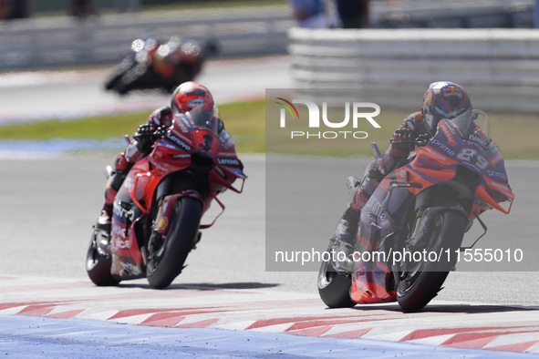 Jorge Martin of Spain and Prima Pramac Racing rides on track in front of Francesco Bagnaia of Italy and Ducati Lenovo Team during the Sprint...