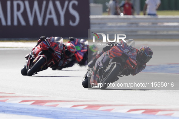 Jorge Martin of Spain and Prima Pramac Racing rides on track in front of Francesco Bagnaia of Italy and Ducati Lenovo Team during the Sprint...