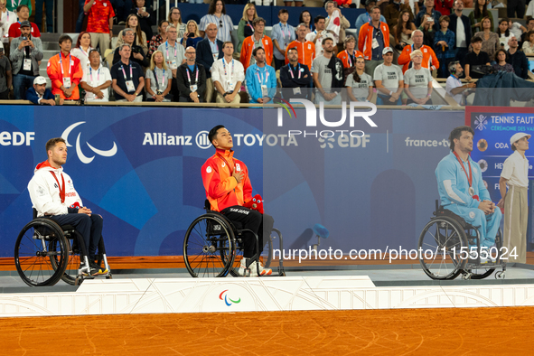 Alfie Hewett of the UK on the left, Tokito Oda of Japan in the center, and Gustavo Fernandez on the right stand on the podium for Wheelchair...