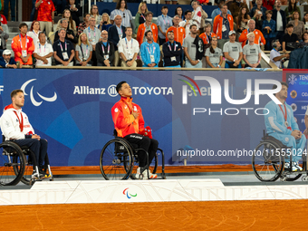 Alfie Hewett of the UK on the left, Tokito Oda of Japan in the center, and Gustavo Fernandez on the right stand on the podium for Wheelchair...