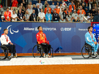 Alfie Hewett of the UK on the left, Tokito Oda of Japan in the center, and Gustavo Fernandez on the right stand on the podium for Wheelchair...