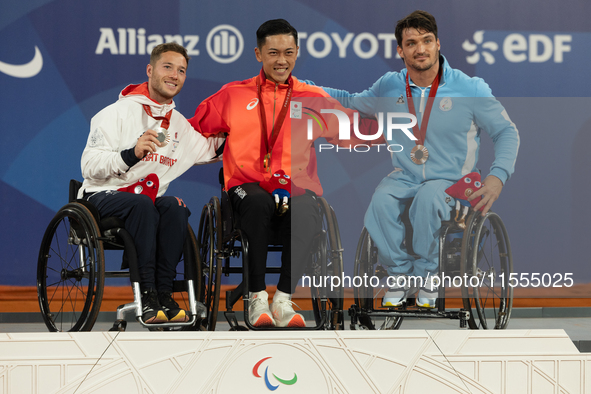 Alfie Hewett of the UK on the left, Tokito Oda of Japan in the center, and Gustavo Fernandez on the right stand on the podium for Wheelchair...