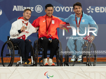 Alfie Hewett of the UK on the left, Tokito Oda of Japan in the center, and Gustavo Fernandez on the right stand on the podium for Wheelchair...