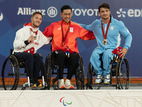 Alfie Hewett of the UK on the left, Tokito Oda of Japan in the center, and Gustavo Fernandez on the right stand on the podium for Wheelchair...