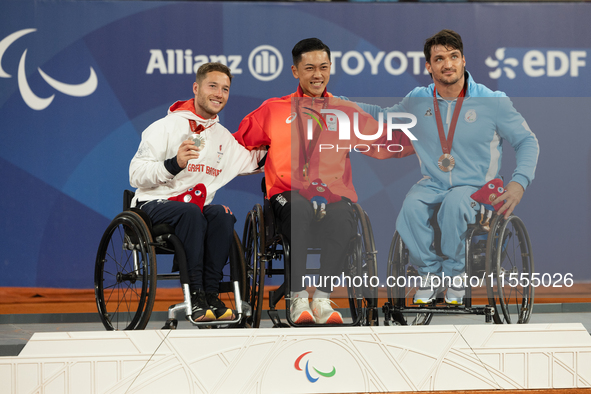 Alfie Hewett of the UK on the left, Tokito Oda of Japan in the center, and Gustavo Fernandez on the right stand on the podium for Wheelchair...