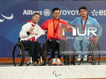 Alfie Hewett of the UK on the left, Tokito Oda of Japan in the center, and Gustavo Fernandez on the right stand on the podium for Wheelchair...