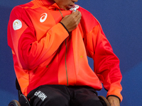 Tokito Oda of Japan reacts on the podium for the gold medal during the Wheelchair Tennis - Men's Singles Gold Medal Match victory ceremony o...