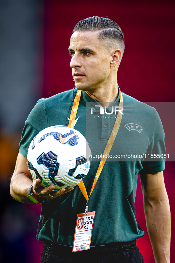 Referee Donatas Rumsas officiates the match between the Netherlands and Bosnia and Herzegovina at the Philips Stadium for the UEFA Nations L...