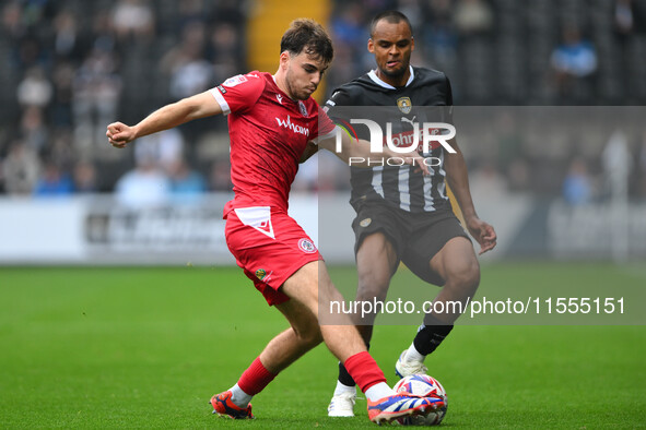 Connor O'Brien of Accrington Stanley is under pressure from Jacob Bedeau of Notts County during the Sky Bet League 2 match between Notts Cou...