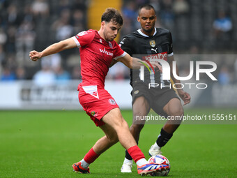 Connor O'Brien of Accrington Stanley is under pressure from Jacob Bedeau of Notts County during the Sky Bet League 2 match between Notts Cou...