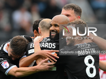 David McGoldrick of Notts County celebrates his second goal with his teammates during the Sky Bet League 2 match between Notts County and Ac...