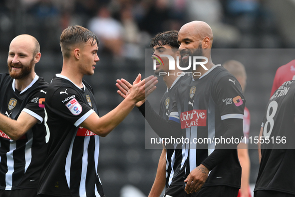 Lewis Macari of Notts County and David McGoldrick of Notts County celebrate during the Sky Bet League 2 match between Notts County and Accri...