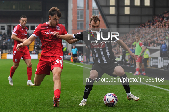 Sam Austin of Notts County is under pressure from Connor O'Brien of Accrington Stanley during the Sky Bet League 2 match between Notts Count...