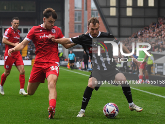 Sam Austin of Notts County is under pressure from Connor O'Brien of Accrington Stanley during the Sky Bet League 2 match between Notts Count...