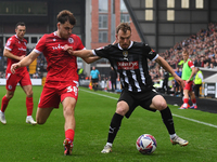 Sam Austin of Notts County is under pressure from Connor O'Brien of Accrington Stanley during the Sky Bet League 2 match between Notts Count...