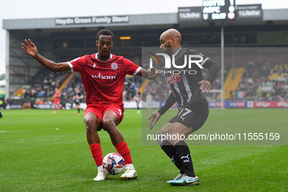 Zach Awe of Accrington Stanley is under pressure from David McGoldrick of Notts County during the Sky Bet League 2 match between Notts Count...