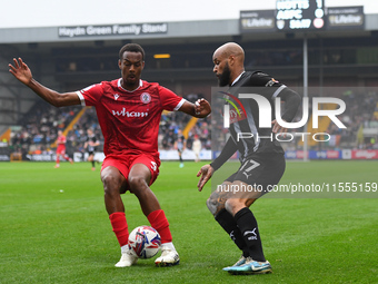 Zach Awe of Accrington Stanley is under pressure from David McGoldrick of Notts County during the Sky Bet League 2 match between Notts Count...