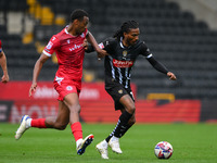 Jevani Brown of Notts County is under pressure from Zach Awe of Accrington Stanley during the Sky Bet League 2 match between Notts County an...