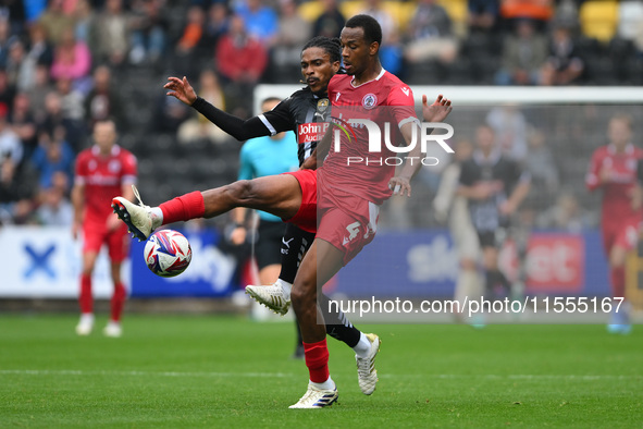 Jevani Brown of Notts County puts pressure on Zach Awe of Accrington Stanley during the Sky Bet League 2 match between Notts County and Accr...