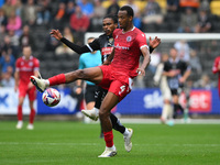 Jevani Brown of Notts County puts pressure on Zach Awe of Accrington Stanley during the Sky Bet League 2 match between Notts County and Accr...