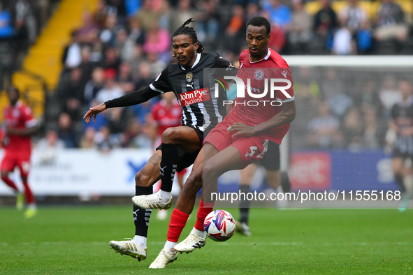 Jevani Brown of Notts County puts pressure on Zach Awe of Accrington Stanley during the Sky Bet League 2 match between Notts County and Accr...