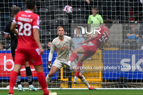 Josh Woods of Accrington Stanley heads the ball at goal, easily saved by Alex Bass of Notts County during the Sky Bet League 2 match between...