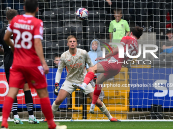 Josh Woods of Accrington Stanley heads the ball at goal, easily saved by Alex Bass of Notts County during the Sky Bet League 2 match between...