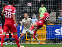 Josh Woods of Accrington Stanley heads the ball at goal, easily saved by Alex Bass of Notts County during the Sky Bet League 2 match between...