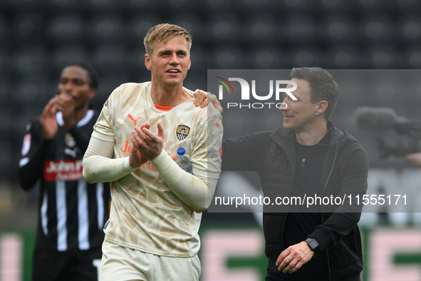 Alex Bass of Notts County and Stuart Maynard, manager of Notts County, celebrate victory during the Sky Bet League 2 match between Notts Cou...