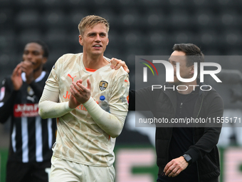 Alex Bass of Notts County and Stuart Maynard, manager of Notts County, celebrate victory during the Sky Bet League 2 match between Notts Cou...