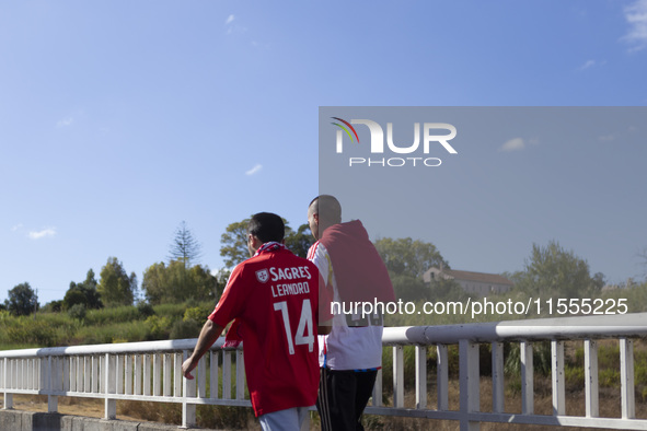 People walk near the Benfica ''Estadio da Luz'' in Lisbon, Portugal, on September 7, 2024. The soccer team has a new coach, Portuguese exper...