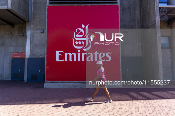 A person walks by an Emirates banner at the Benfica ''Estadio da Luz'' in Lisbon, Portugal, on September 7, 2024. The soccer team has a new...