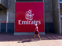 A person walks by an Emirates banner at the Benfica ''Estadio da Luz'' in Lisbon, Portugal, on September 7, 2024. The soccer team has a new...