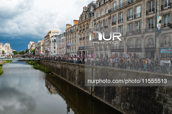 People march holding a banner that reads, 'A single solution destitution', during a protest after the appointment of a right-wing prime mini...