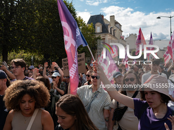 People march holding a banner that reads, 'A single solution destitution', during a protest after the appointment of a right-wing prime mini...