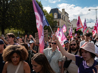 People march holding a banner that reads, 'A single solution destitution', during a protest after the appointment of a right-wing prime mini...