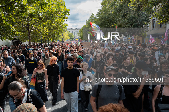 People march holding a banner that reads, 'A single solution destitution', during a protest after the appointment of a right-wing prime mini...