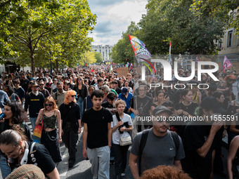 People march holding a banner that reads, 'A single solution destitution', during a protest after the appointment of a right-wing prime mini...