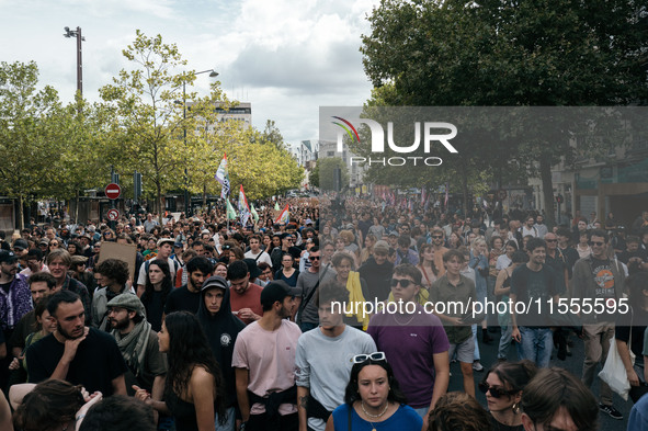 People march holding a banner that reads, 'A single solution destitution', during a protest after the appointment of a right-wing prime mini...