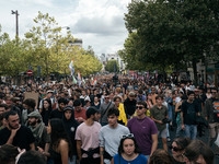 People march holding a banner that reads, 'A single solution destitution', during a protest after the appointment of a right-wing prime mini...