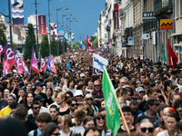 People march holding a banner that reads, 'A single solution destitution', during a protest after the appointment of a right-wing prime mini...