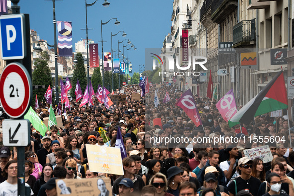 People march holding a banner that reads, 'A single solution destitution', during a protest after the appointment of a right-wing prime mini...